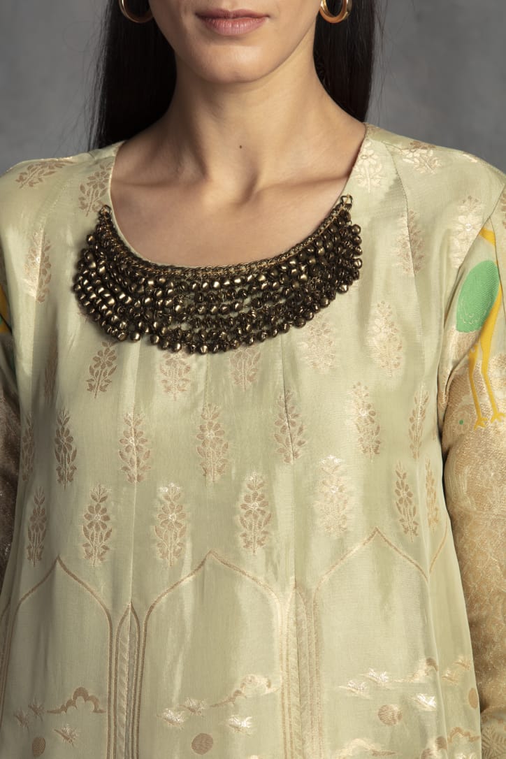 Buy gorgeous pista green Banarasi silk suit online in USA with palazzo. Make a fashion statement on festive occasions with palazzo suits, sharara suits, partywear dresses, salwar suits from Pure Elegance Indian fashion store in USA.-neckline