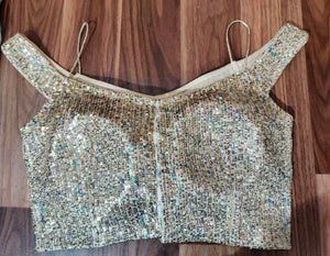 Buy stunning golden sequin work off-shoulder saree blouse online in USA. Elevate your Indian ethnic sari looks with exquisite readymade saree blouse, embroidered saree blouses, Banarasi sari blouse, designer saree blouse from Pure Elegance Indian clothing store in USA.-back