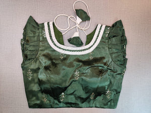Buy stunning dark green saree blouse online in USA with frill sleeves. Elevate your Indian ethnic saree looks with beautiful readymade saree blouse, embroidered saree blouses, Banarasi saree blouse, designer sari blouses from Pure Elegance Indian fashion store in USA.-front