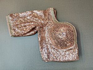 Buy stunning rose gold sequin designer saree blouse online in USA. Elevate your Indian ethnic saree looks with beautiful readymade saree blouse, embroidered saree blouses, Banarasi saree blouse, designer sari blouses, sleeveless saree blouses from Pure Elegance Indian fashion store in USA.-sleeve