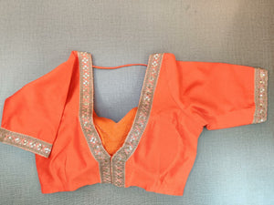 Shop stunning bright orange embroidered sari blouse online in USA. Elevate your Indian ethnic saree looks with beautiful readymade saree blouse, embroidered saree blouses, Banarasi saree blouse, designer sari blouses from Pure Elegance Indian fashion store in USA.-back
