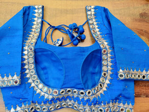 Shop gorgeous blue mirror embroidery designer saree blouse online in USA. Elevate your ethnic saree style with a tasteful collection of designer saree blouses, embroidered sari blouses, Banarasi blouses, silk saree blouses from Pure Elegance Indian clothing store in USA.-back