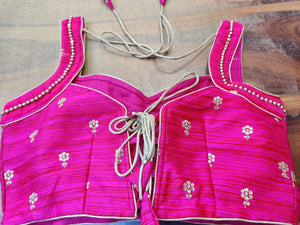 Shop fuschia pink designer sari blouse online in USA with embroidery. Elevate your ethnic saree style with a tasteful collection of designer sari blouses, embroidered saree blouses, Banarasi blouse, silk sari blouse from Pure Elegance Indian clothing store in USA.-back