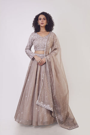 Buy stunning beige lehenga online in USA with dupatta. Get festive ready in beautiful designer Anarkali suits, designer lehenga, wedding gowns, sharara suits, designer sarees from Pure Elegance Indian fashion store in USA.-front