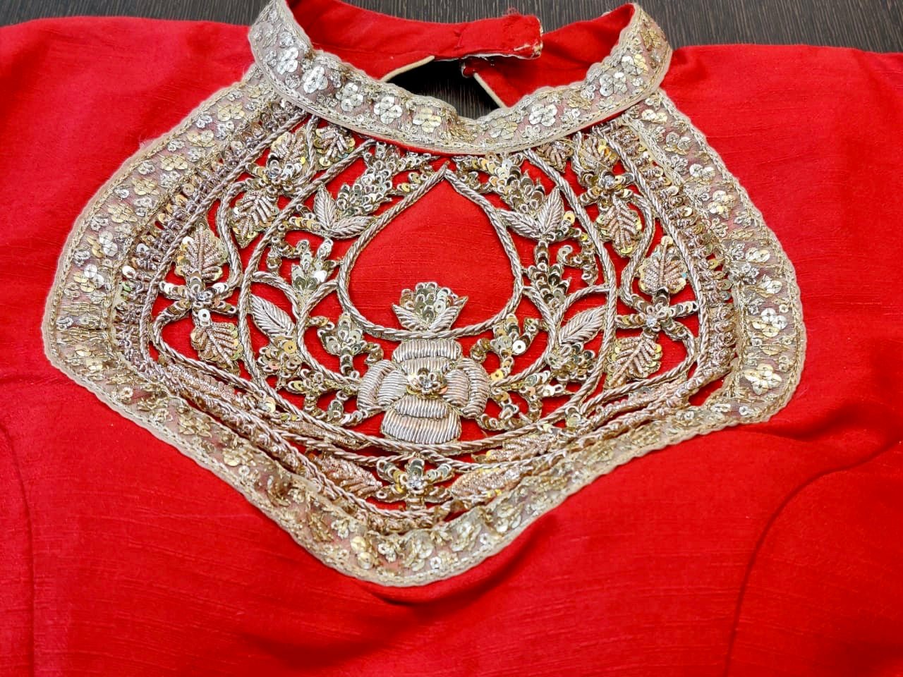 Shop red designer saree blouse online in USA with embroidered neck. Elevate your ethnic saree style with a tasteful collection of designer saree blouses, embroidered saree blouses, Banarasi saree blouse, silk sari blouse from Pure Elegance Indian clothing store in USA.-neck