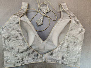 Buy stunning grey stone work sleeveless sari blouse online in USA. Elevate your Indian ethnic sari looks with exquisite readymade saree blouse, embroidered saree blouses, Banarasi sari blouse, designer saree blouse from Pure Elegance Indian clothing store in USA.-back