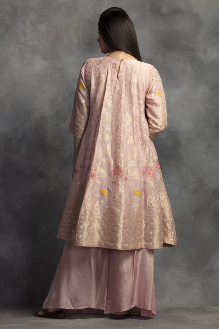 Shop beautiful powder pink Banarasi silk suit online in USA with palazzo. Make a fashion statement on festive occasions with palazzo suits, sharara suits, partywear dresses, salwar suits from Pure Elegance Indian fashion store in USA.-back