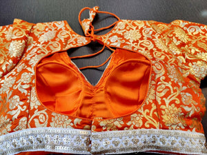 Buy  beautiful orange zari work sari blouse online in USA with embroidered lace. Elevate your ethnic sari style with a stunning collection of designer saree blouses, embroidered saree blouses, Banarasi sari blouse, silk sari blouse from Pure Elegance Indian clothing store in USA.-back