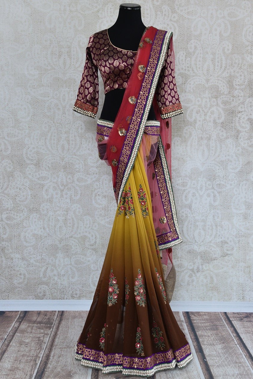 90A486 Traditional Indian half georgette, half net sari with traditional motifs and embellishments with designer blouse. This saree is ideal for Indian weddings. The shaded yellow and pink saree is available online at our ethnic clothing store in USA - Pure Elegance.