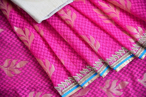 90a621 Embroidered pink saree for sale online at Pure Elegance in USA. The jute Banarasi saree with golden leafy pattern comes with a beige, embroidered raw silk designer blouse. This saree makes for the perfect Indian outfit to wear at small wedding function. 