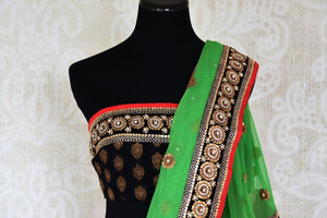 Shop green net and black georgette half n half embroidered saree online in USA from Pure Elegance. Let your ethnic style be one of a kind with an exquisite variety of Indian handloom sarees, pure silk sarees, designer sarees from our exclusive fashion store in USA.-blouse pallu