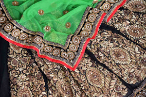 Shop green net and black georgette half n half embroidered saree online in USA from Pure Elegance. Let your ethnic style be one of a kind with an exquisite variety of Indian handloom sarees, pure silk sarees, designer sarees from our exclusive fashion store in USA.-details