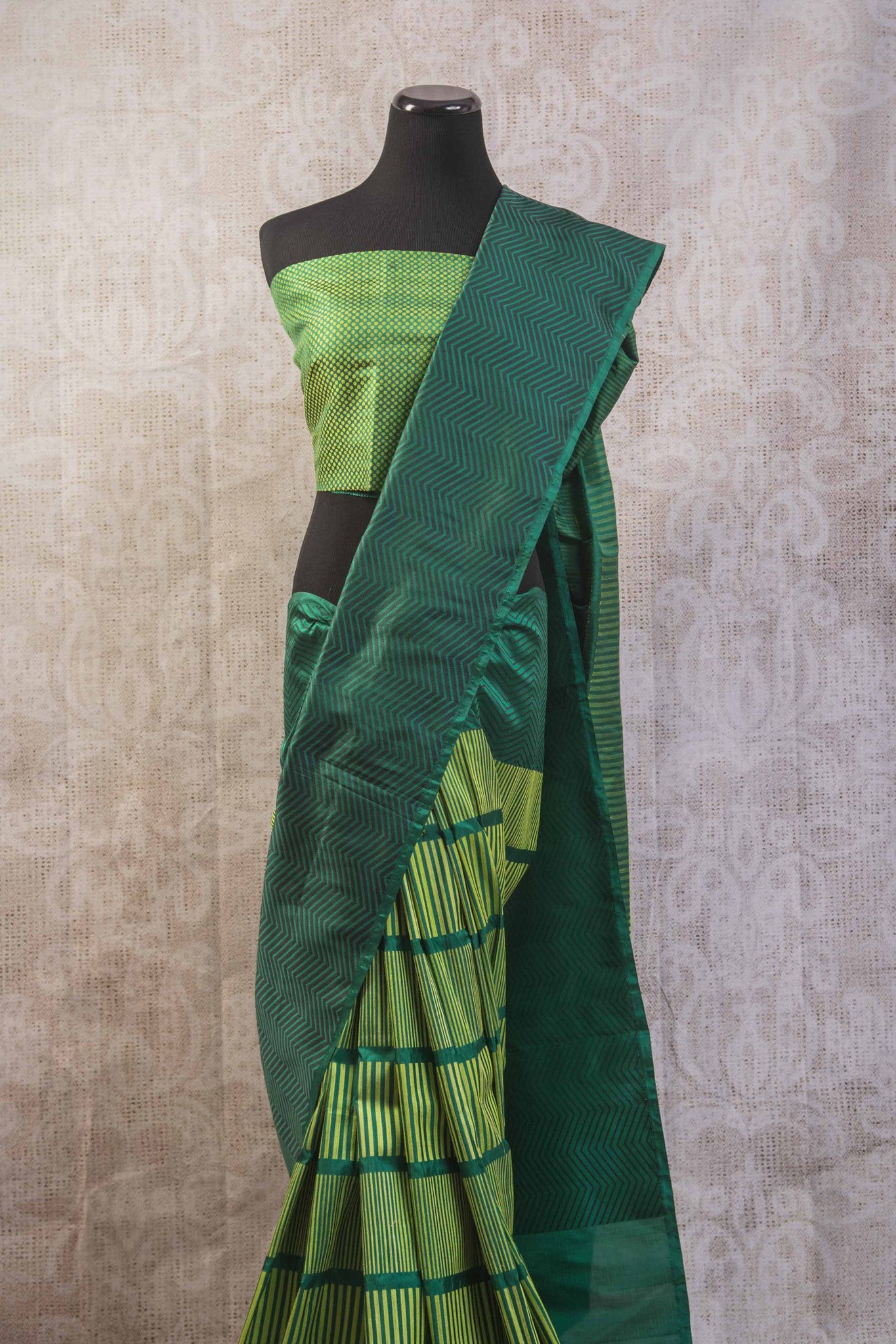 90b256 Multi green Banarasi silk saree from India with zig zag stripes & satin black pallu. The simple sari is available at our Indian wear store in USA, Pure Elegance. This one is perfect for parties, get-togethers and pujas.