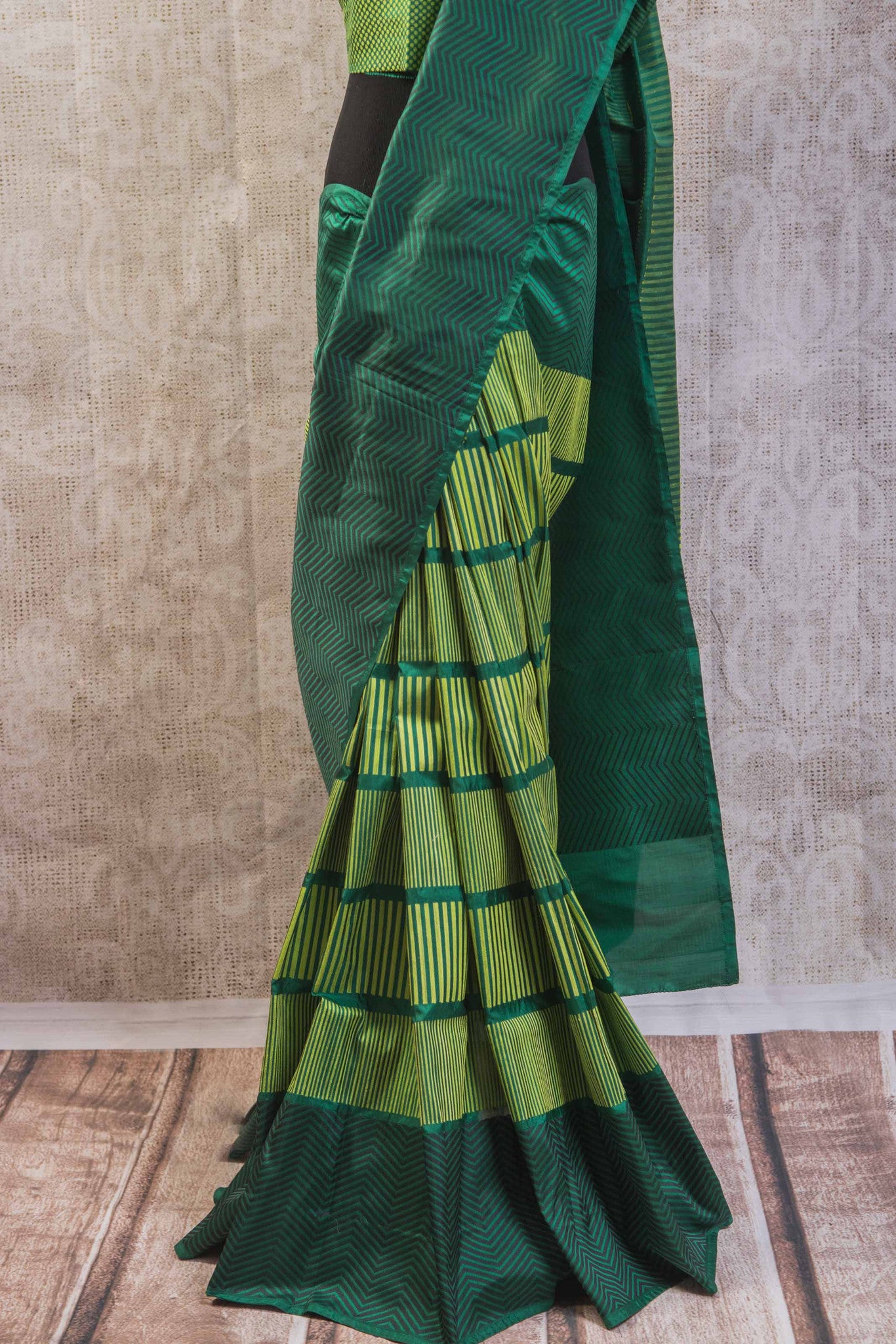 90b256 Multi green Banarasi silk saree with zig-zag stripes & satin black pallu. Buy this simple sari online at our Indian clothing store in USA, Pure Elegance. This one is perfect for pujas, get-togethers and functions!