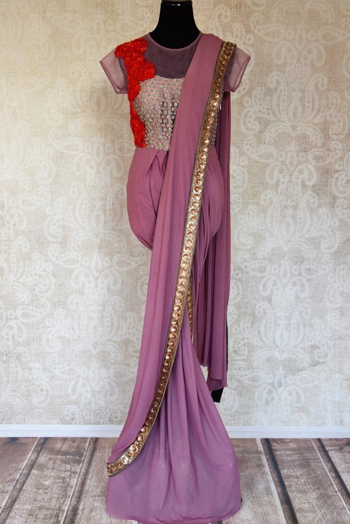 Shop mauve embroidered designer net saree online in USA from Pure Elegance. Let your ethnic style be one of a kind with an exquisite variety of Indian designer sarees, pure silk sarees, Bollywood sarees from our exclusive fashion store in USA.-full view