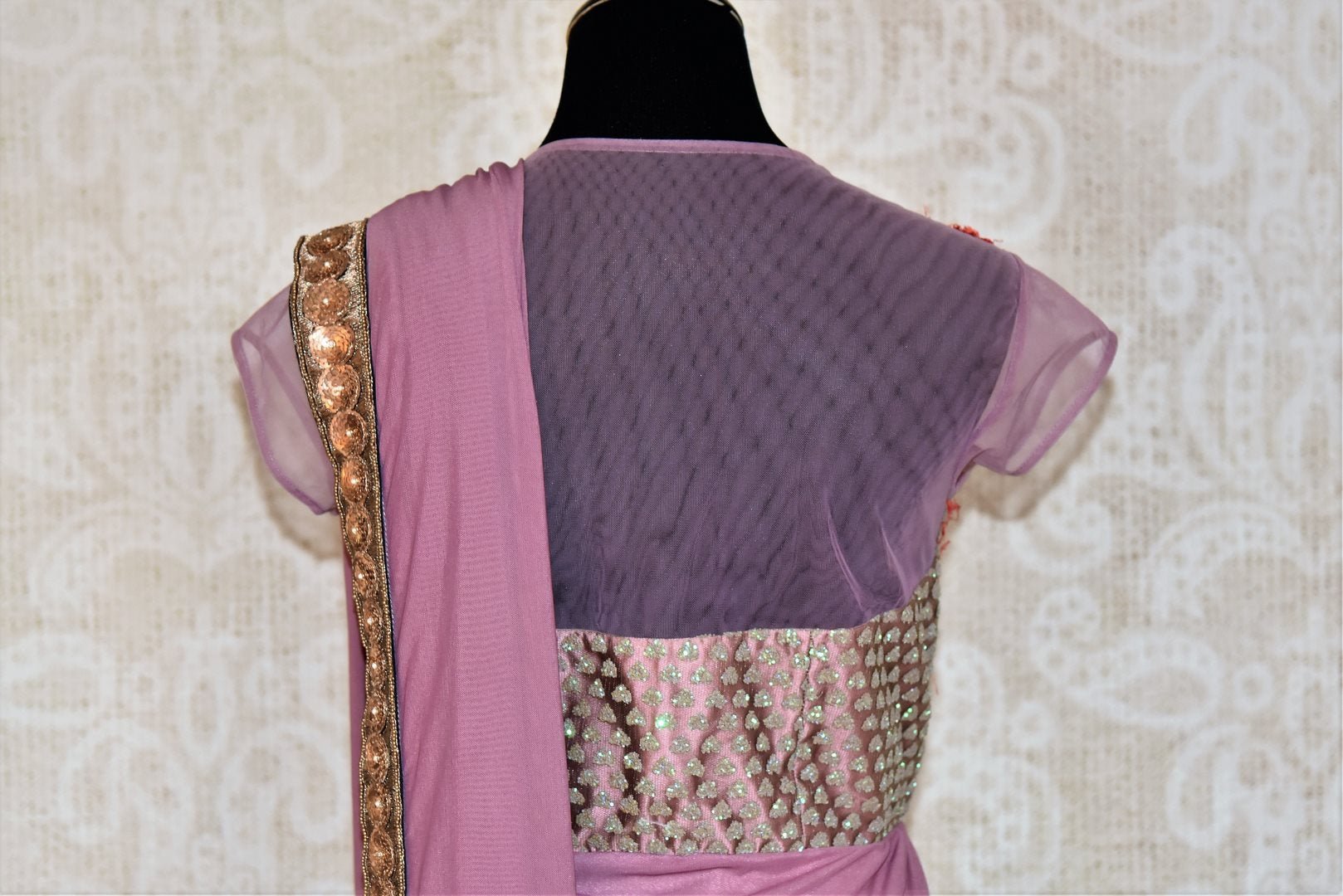 Shop mauve embroidered designer net saree online in USA from Pure Elegance. Let your ethnic style be one of a kind with an exquisite variety of Indian designer sarees, pure silk sarees, Bollywood sarees from our exclusive fashion store in USA.-back