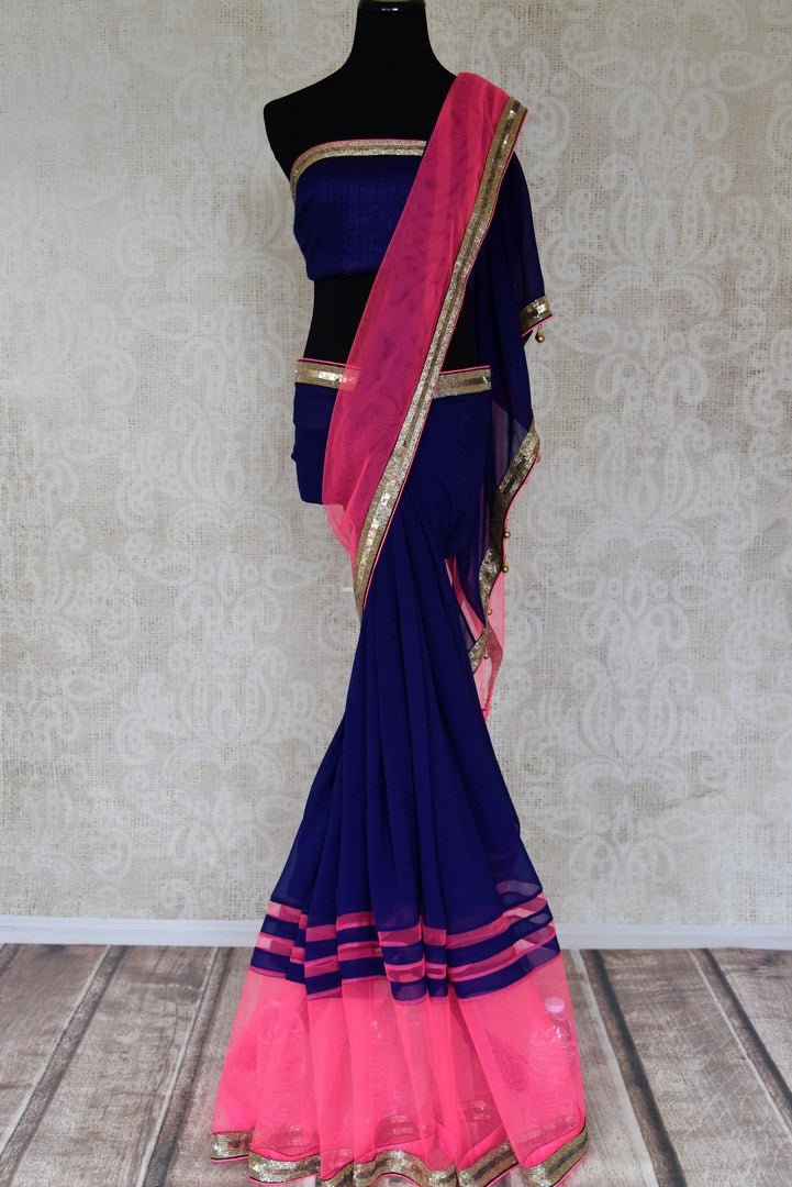 Buy dark blue georgette saree online in USA with pink embroidered net border from Pure Elegance. Let your ethnic style be one of a kind with an exquisite variety of Indian handloom sarees, pure silk sarees, designer sarees from our exclusive fashion store in USA.-full view