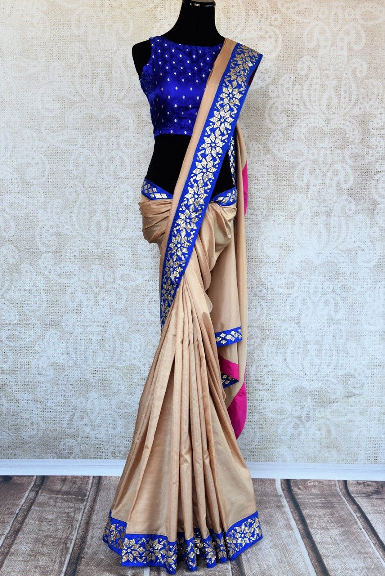 Buy beige saree online in USA with blue zircon border from Pure Elegance Indian fashion store in USA.-full view