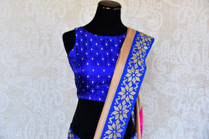 Buy beige saree online in USA with blue zircon border from Pure Elegance Indian fashion store in USA.-front
