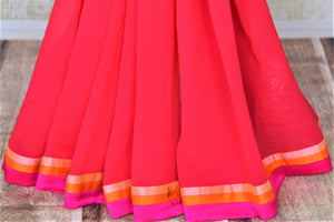 Shop pink white and peach shaded georgette saree online in USA with designer saree blouse. Be the talk of the parties in beautiful designer sarees with blouse, embroidered sarees from Pure Elegance Indian fashion store in USA.-pleats