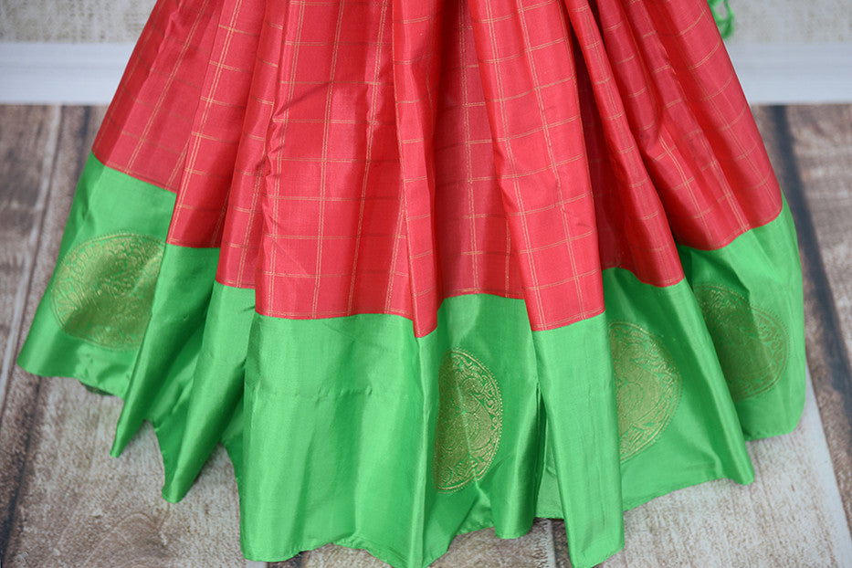 It's a red kanchivaram sari with checks in bottom with green blouse and border. It also has yellow border. Perfect traditional sari for party, festive occasion - bottom view
