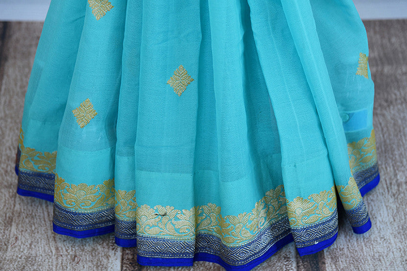 Classic color combination of Light blue and royal blue in georgette banarasi saree. Ideal saree for festivals, pujas.- pleats