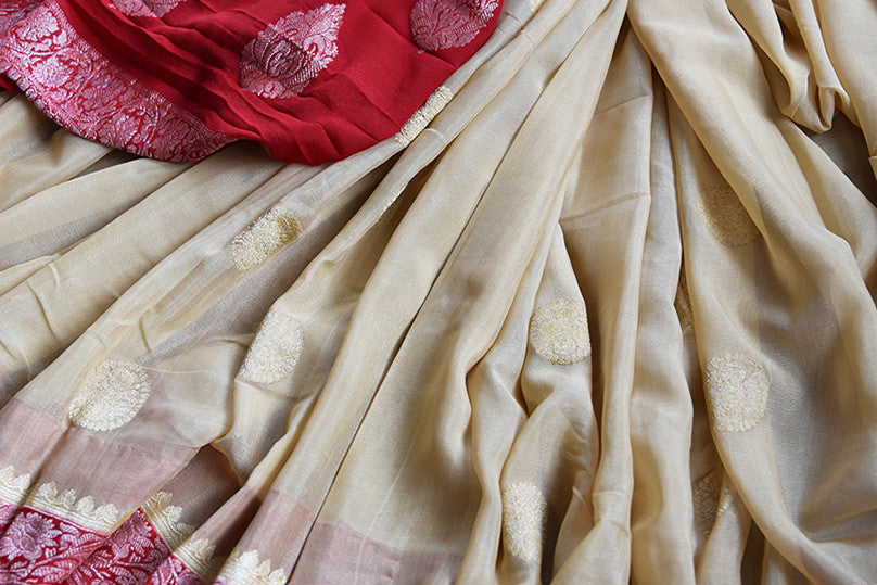 Beige and red chiffon banarasi saree. Traditional as well modern sari perfect for Indian wedding and reception.- close up
