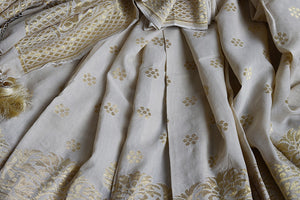 Classic and elegant off white hand woven muga banarasi saree. Perfect for festivals and pujas.-close up buta