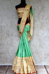 Buy green striped Banarasi silk saree online with gold tissue border. Pure Elegance store presents exquisite range of designer Indian sarees online for women in USA.-full view