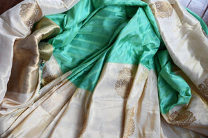 Buy green striped Banarasi silk saree online with gold tissue border. Pure Elegance store presents exquisite range of designer Indian sarees online for women in USA.-details