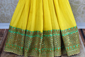 Buy yellow and pink half Banarasi and half silk embroidered sari online in USA with blouse.  Our fashion store brings a beautiful range of Indian designer saris in USA.-pleats