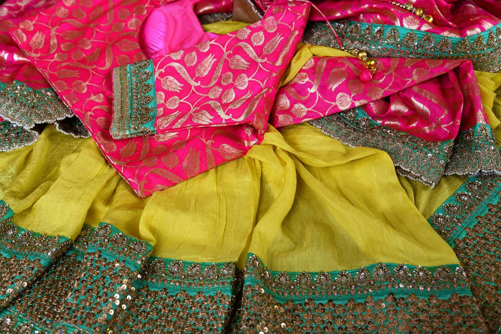 Buy yellow and pink half Banarasi and half silk embroidered sari online in USA with blouse.  Our fashion store brings a beautiful range of Indian designer saris in USA.-details