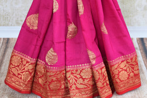 Buy bright pink muga Banarasi saree online in USA. Pure Elegance clothing store brings an exquisite variety of Indian woven Banarasi sarees for online shopping in USA. -pleats