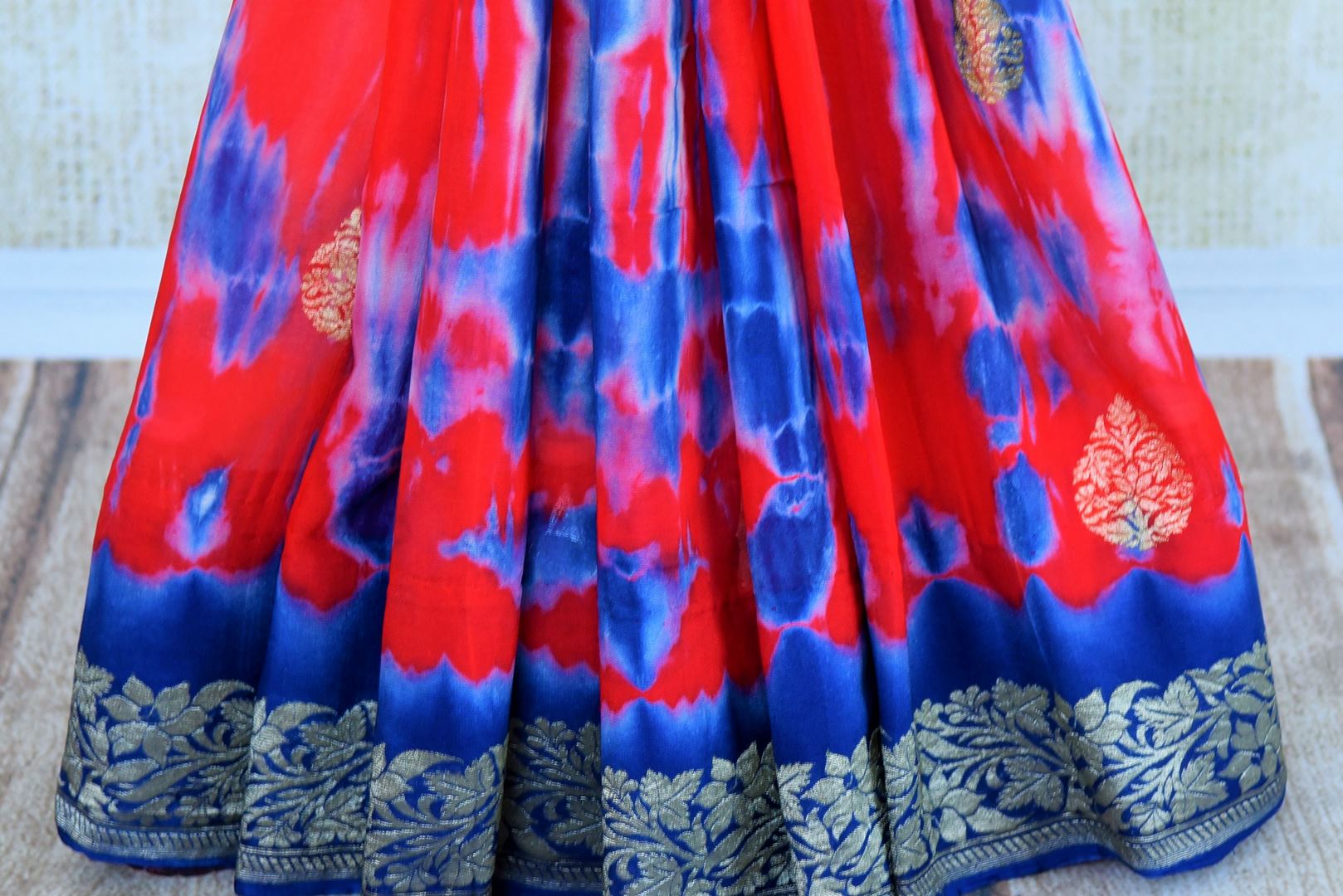 Buy red and blue marble dye georgette Banarasi sari online in USA. Pure Elegance store brings an exquisite range of Indian Banarasi sarees for online shopping in USA. -pleats