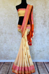 Buy cream georgette Banarasi sari with pink border online in USA. Pure Elegance store brings an exquisite range of Indian Banarasi sarees for online shopping in USA. -full view