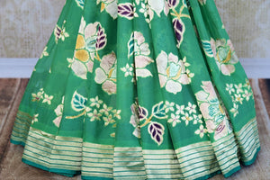 Buy green georgette Banarasi saree online in USA. Pure Elegance store brings an exquisite range of Indian designer Banarasi sarees for online shopping in USA. Shop now.-pleats