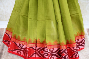 Buy green eri silk saree online in USA with red border. Pure Elegance clothing store brings an exquisite range of Indian silk sarees in USA for women. Shop online.-pleats