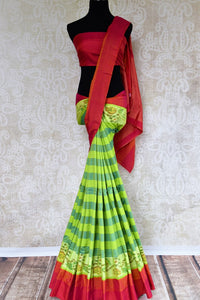 Buy green striped eri silk saree online in USA with pink border. Pure Elegance clothing store brings an exquisite range of Indian silk sarees in USA for women. Shop online.-full view