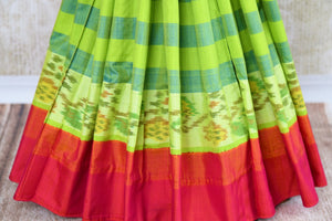 Buy green striped eri silk saree online in USA with pink border. Pure Elegance clothing store brings an exquisite range of Indian silk sarees in USA for women. Shop online.-pleats