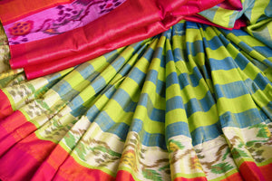 Buy green striped eri silk saree online in USA with pink border. Pure Elegance clothing store brings an exquisite range of Indian silk sarees in USA for women. Shop online.-details