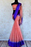 Buy pink ikat khaddi sari online in USA with blue border. Pure Elegance clothing store brings an alluring collection of ethnic Indian ikkat saris in USA for women. -full view