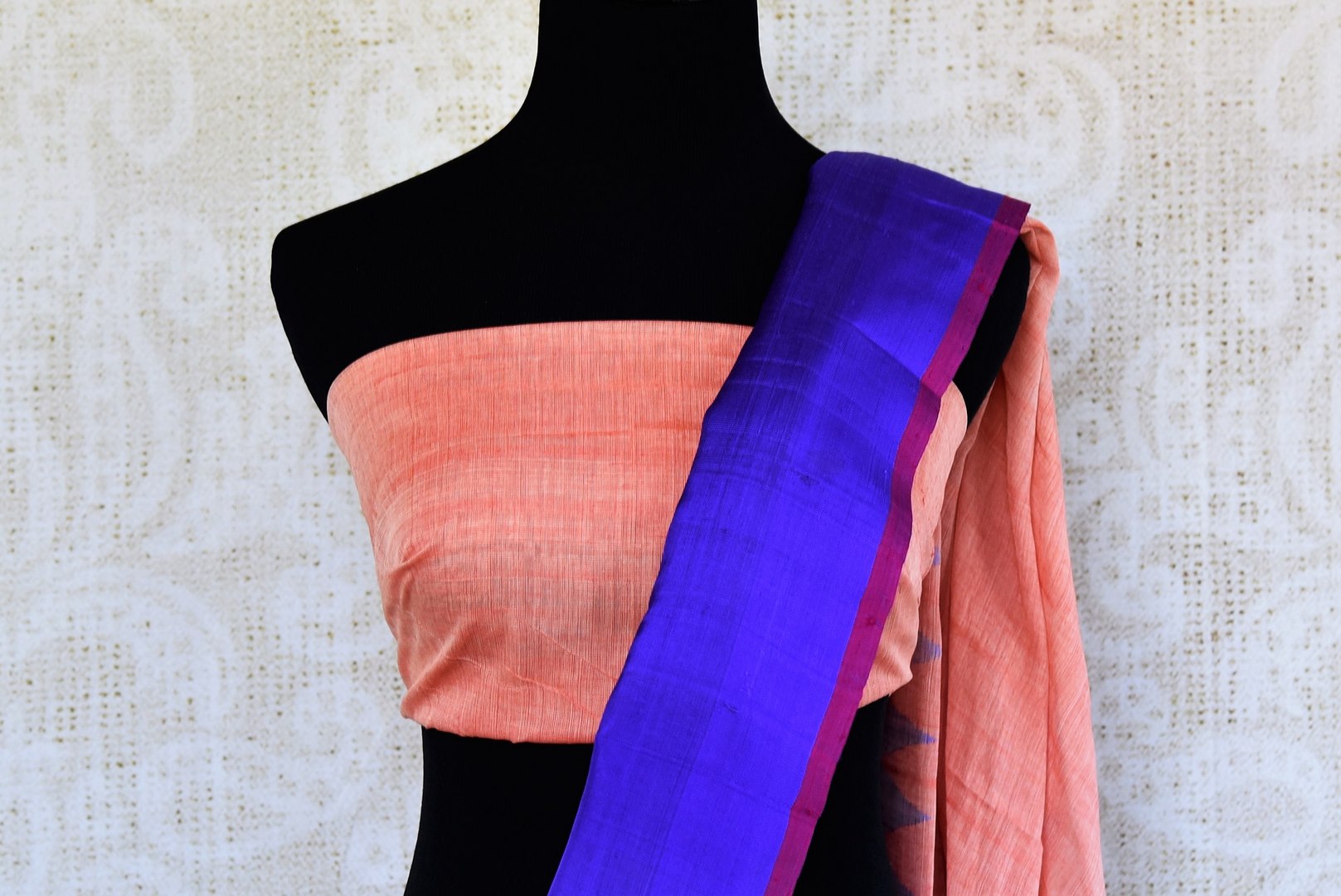 Buy pink ikat khaddi sari online in USA with blue border. Pure Elegance clothing store brings an alluring collection of ethnic Indian ikkat saris in USA for women. -blouse pallu
