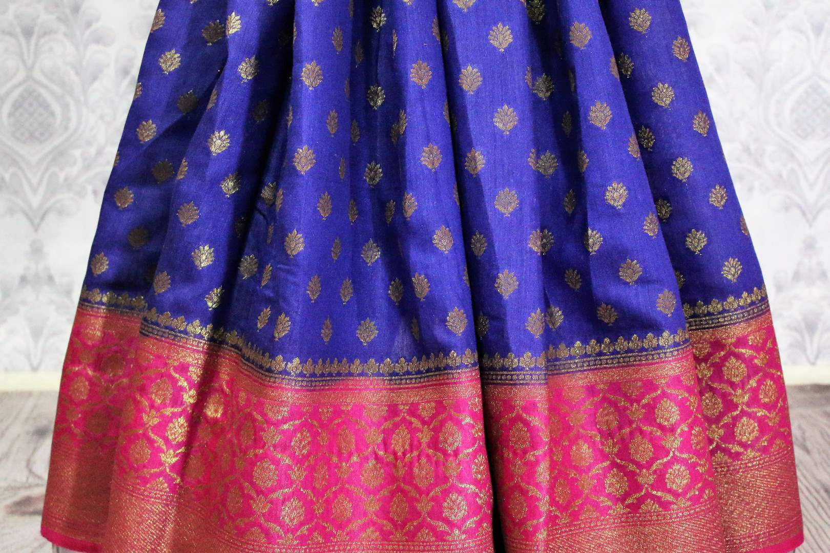 Blue Muga Banarasi sari for online shopping in USA. Pure Elegance fashion store brings an alluring range of exquisite Indian handloom sarees in USA for women. -pleats