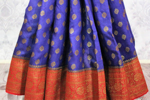 Traditional dark blue Muga Banarasi saree for online shopping in USA. Pure Elegance fashion store brings an alluring range of exquisite Indian handloom sarees in USA for women. -pleats