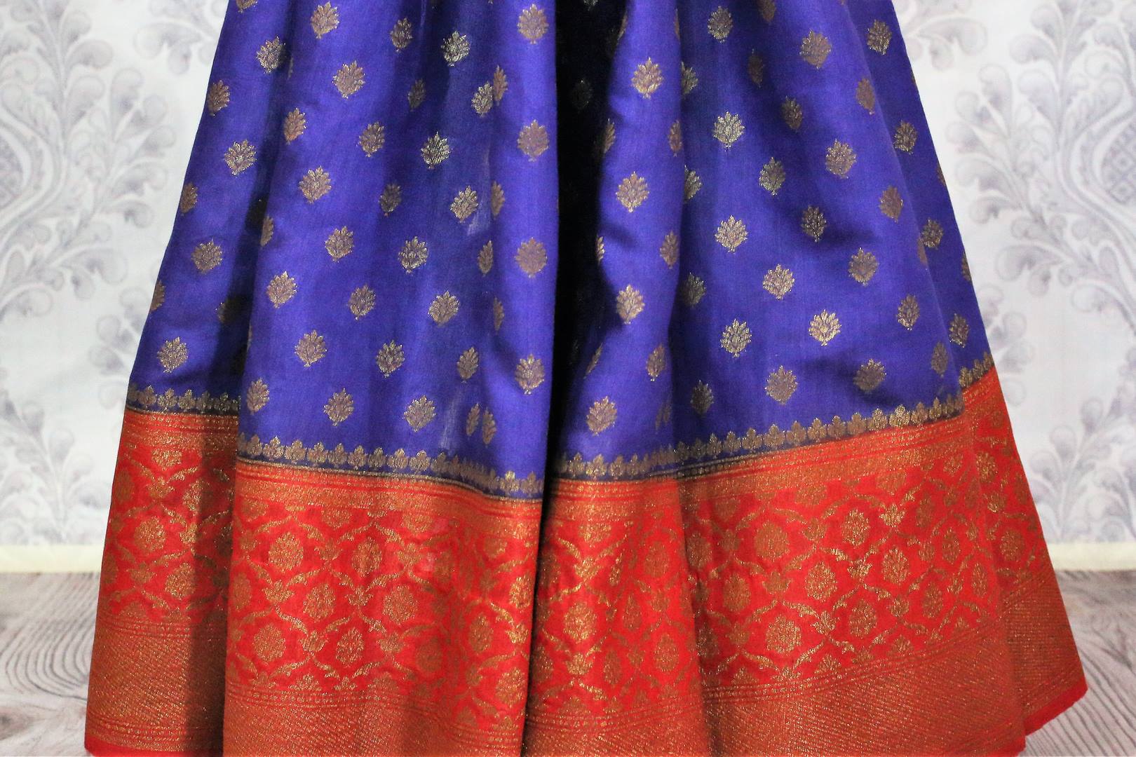 Rich blue Muga Banarasi saree with buta for online shopping in USA. Pure Elegance fashion store brings an alluring range of Indian handloom saris in USA for women. -pleats
