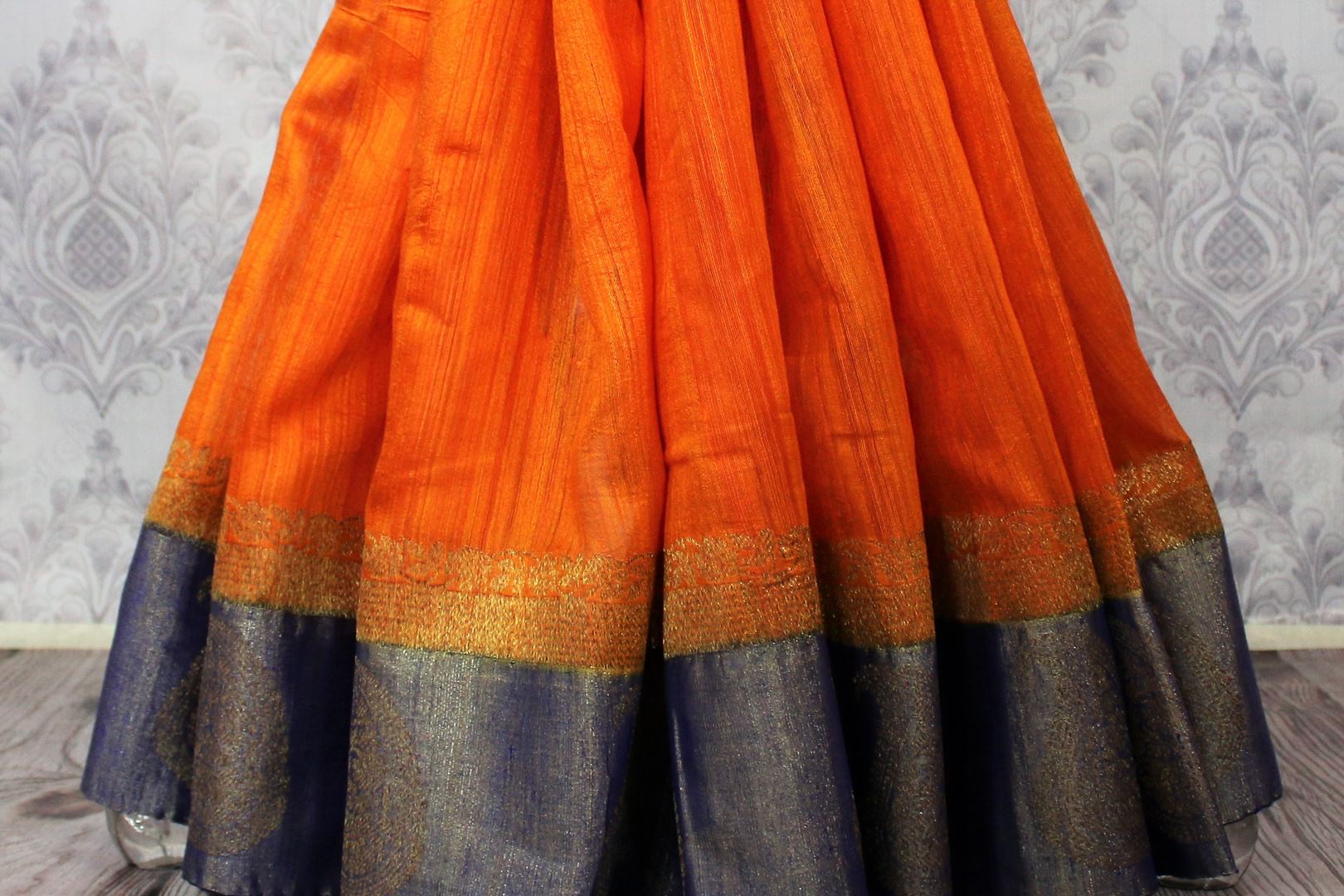 Buy orange tussar Banarasi sari online in USA with blue border. Browse through a range of exclusive Indian designer sarees in USA at Pure Elegance online store. Shop now.-pleats