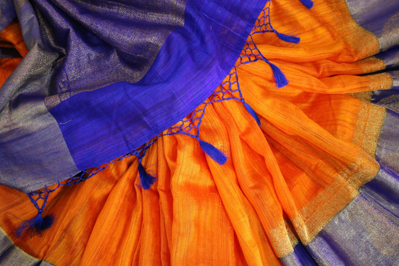 Buy orange tussar Banarasi sari online in USA with blue border. Browse through a range of exclusive Indian designer sarees in USA at Pure Elegance online store. Shop now.-details