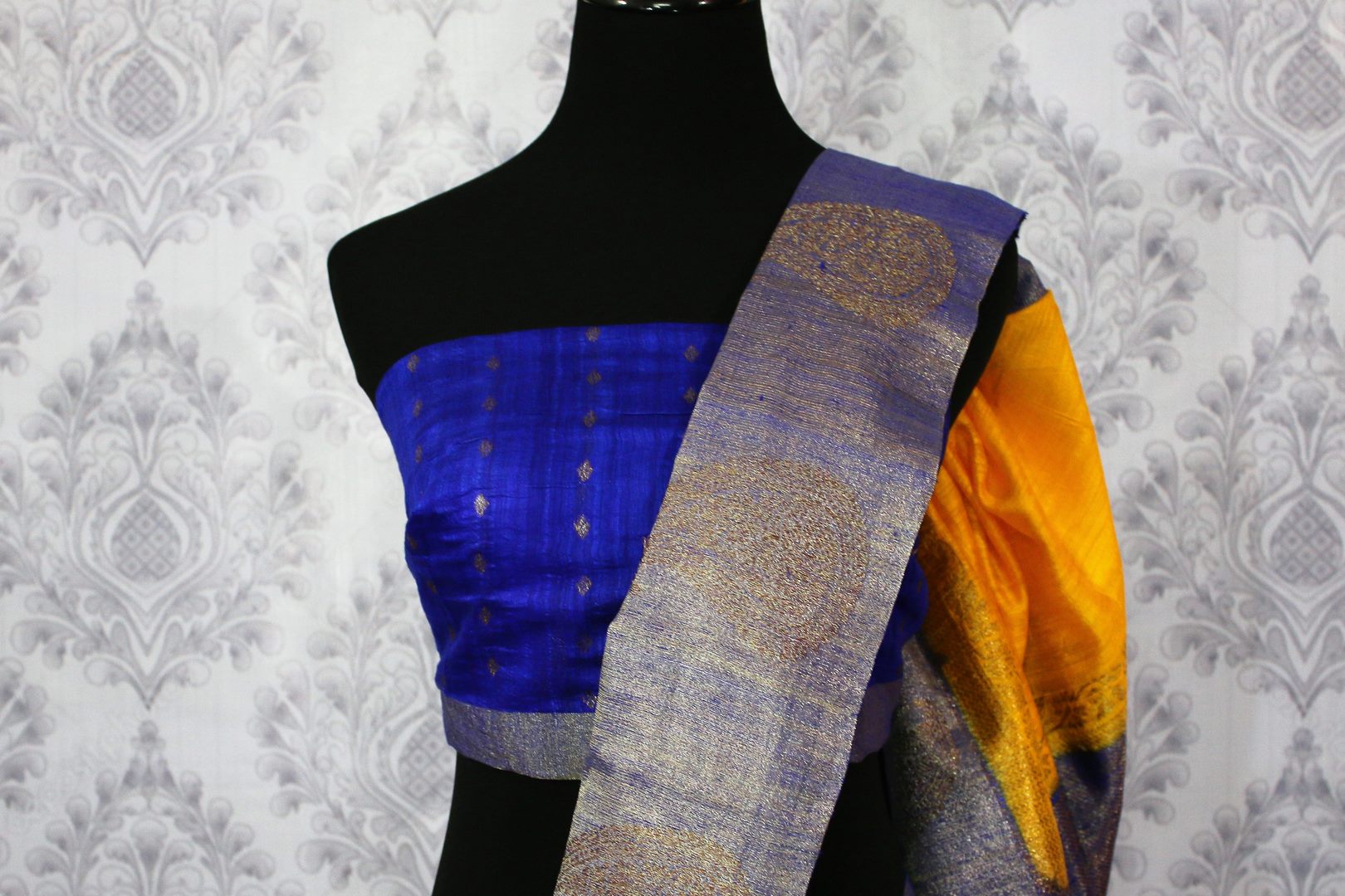 Shop yellow tussar Banarasi sari online in USA with blue border. Browse through a range of exclusive Indian handloom sarees in USA at Pure Elegance online store. -blouse pallu