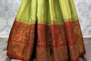 Shop light green tussar Banarasi sari online in USA. Browse through a range of exclusive Indian handloom sarees in USA at Pure Elegance online store. Shop now.-pleats