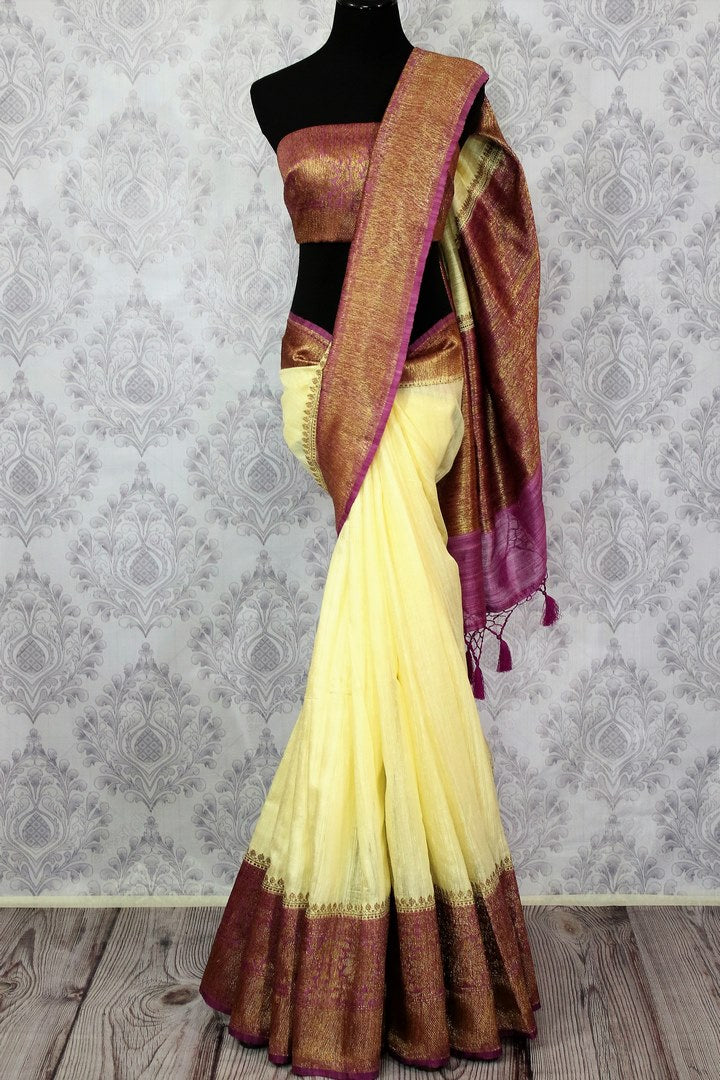 Buy cream Banarasi tussar saree online in USA with purple border. Browse through a range of traditional Indian saris in USA at Pure Elegance online store. Shop now.-full view